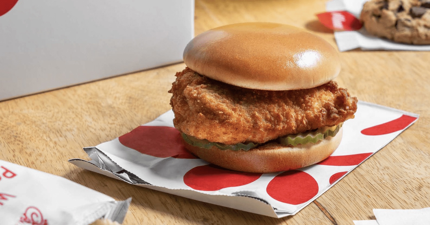 A Chick-fil-A chicken sandwich, freshly served in its signature red and white packaging